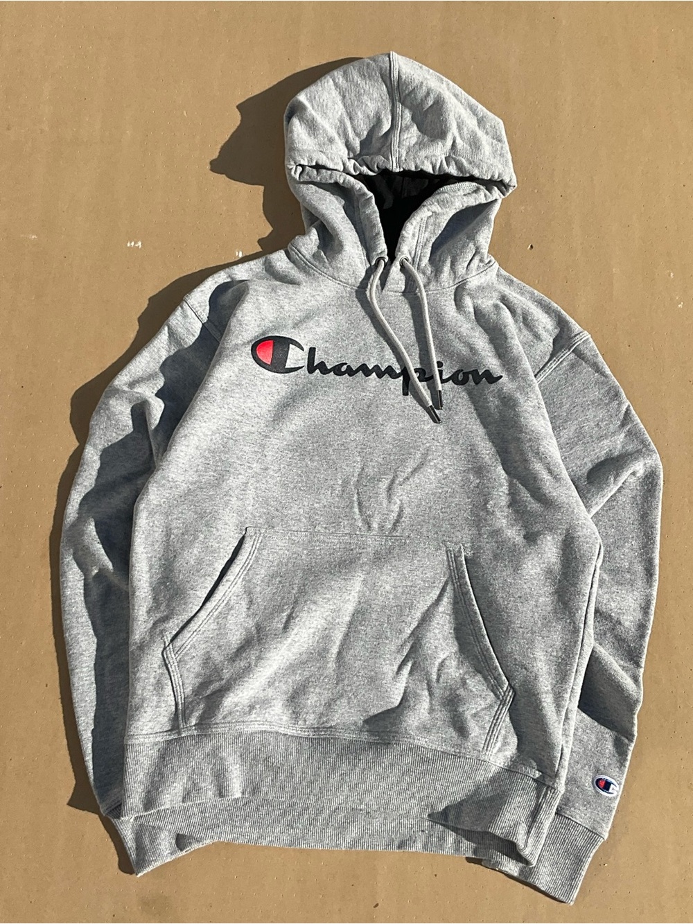 Champion Grey Pullover Hoodie with Script Logo and Red Emblem
